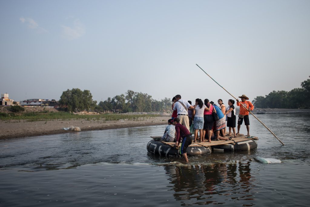 People crossing the river from Guatemala to Mexico, 1 May 2017.