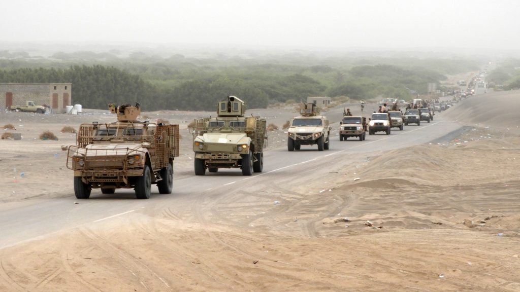 A column of Yemeni pro-government forces and armoured vehicles arrives in al-Durayhimi district, about nine kilometres south of Hodeidah international airport on June 13, 2018. - Yemeni forces backed by the Saudi-led coalition launched an offensive on June 13 to retake the rebel-held Red Sea port city of Hodeida, pressing toward the airport south of the city. The port serves as the entry point for 70 percent of the impoverished country's imports as it teeters on the brink of famine. (Photo by NABIL HASSAN / AFP) (Photo credit should read NABIL HASSAN/AFP/Getty Images)