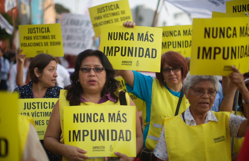 Women demonstrators seen holding several placards during a