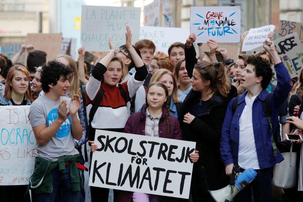 16-year-old Swedish environmental activist Greta Thunberg and Anuna De Wever, a Belgian climate student activist, take part in a protest claiming for urgent measures to combat climate change, in Paris, France, February 22, 2019. REUTERS/Philippe Wojazer - RC1E325AE0C0