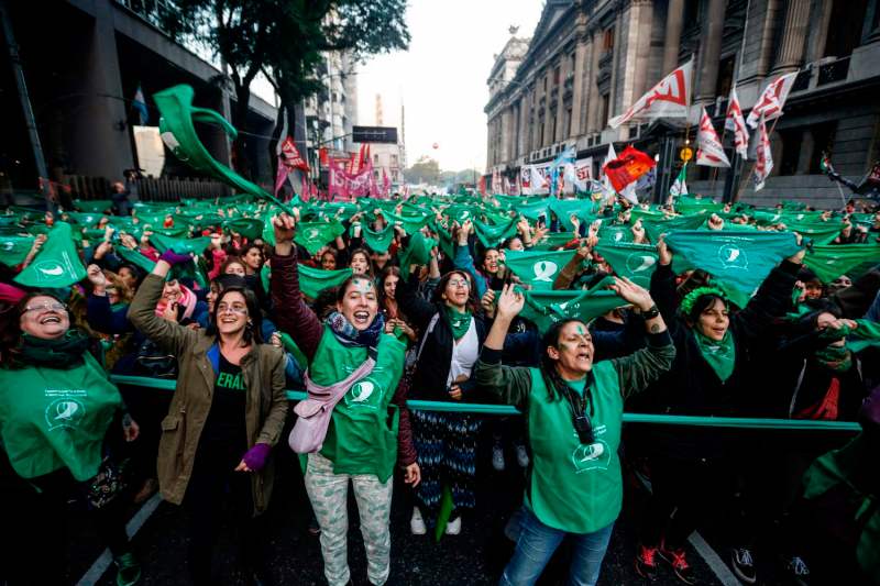 Activists with green handkerchiefs, which symbolizes the abortion rights movement, demonstrate to mark the revival of their campaign to legalize abortion, in front of the National Congress in Buenos Aires, on May 28, 2019. - Activists and lawmakers in Argentina relaunched a bid to legalize abortion on Tuesday with a new bill before Congress and a major demonstration, resuming a battle that has divided the homeland of Pope Francis ahead of October's general election. (Photo by Emiliano Lasalvia / AFP)        (Photo credit should read EMILIANO LASALVIA/AFP/Getty Images)