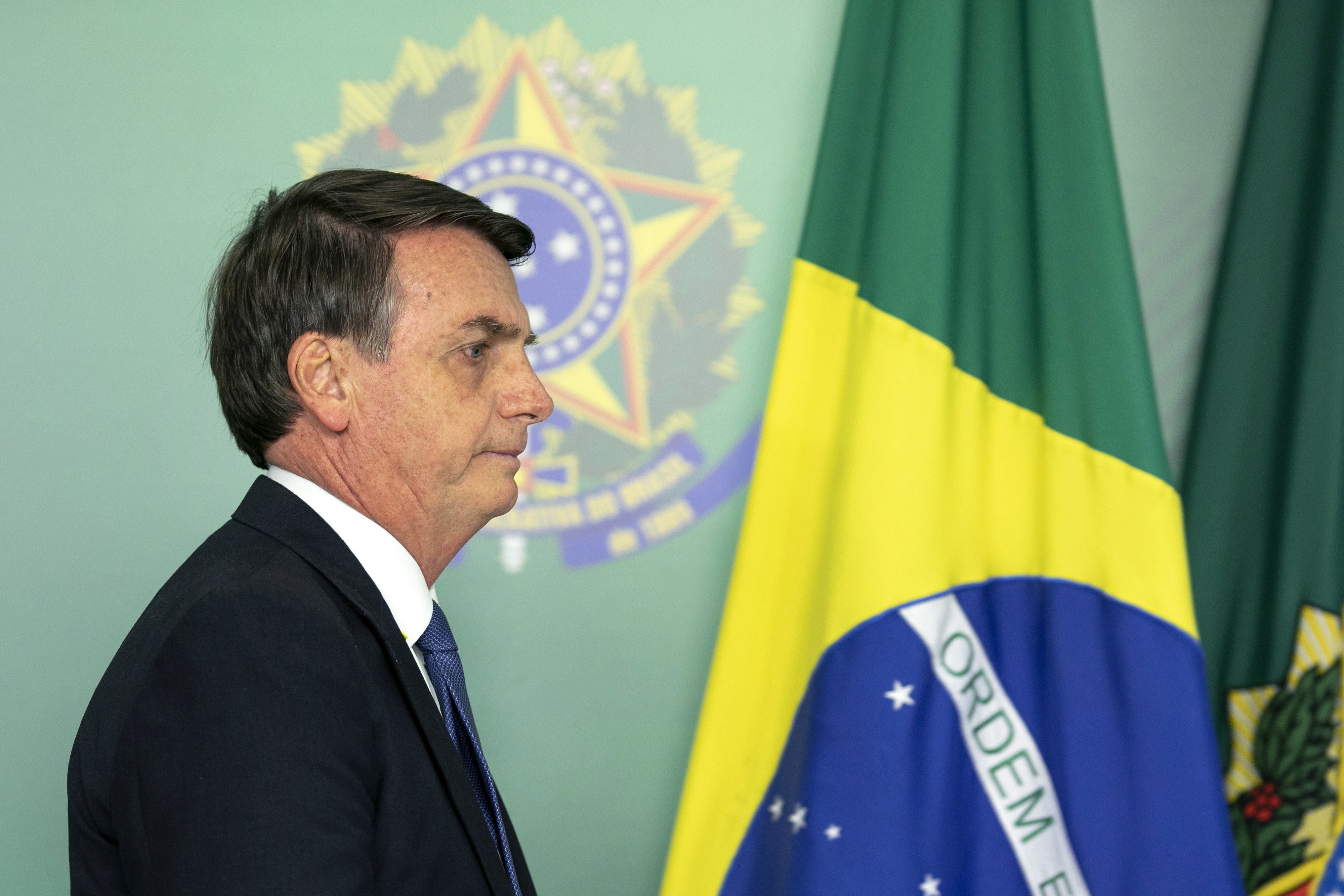 Brazilian President Jair Bolsonaro arrives to give a statement in Brasilia on January 25, 2019 on the collapse of a dam near Brumadinho in southeastern Brazil. - A dam collapse in southeastern Brazil unleashed a torrent of mud on a riverside town and surrounding farmland Friday, destroying houses, leaving 200 people missing and raising fears of a number of deaths, according to officials. The dam belonged to Brazilian mining giant Vale. (Photo by Sergio LIMA / AFP) (Photo credit should read SERGIO LIMA/AFP/Getty Images)