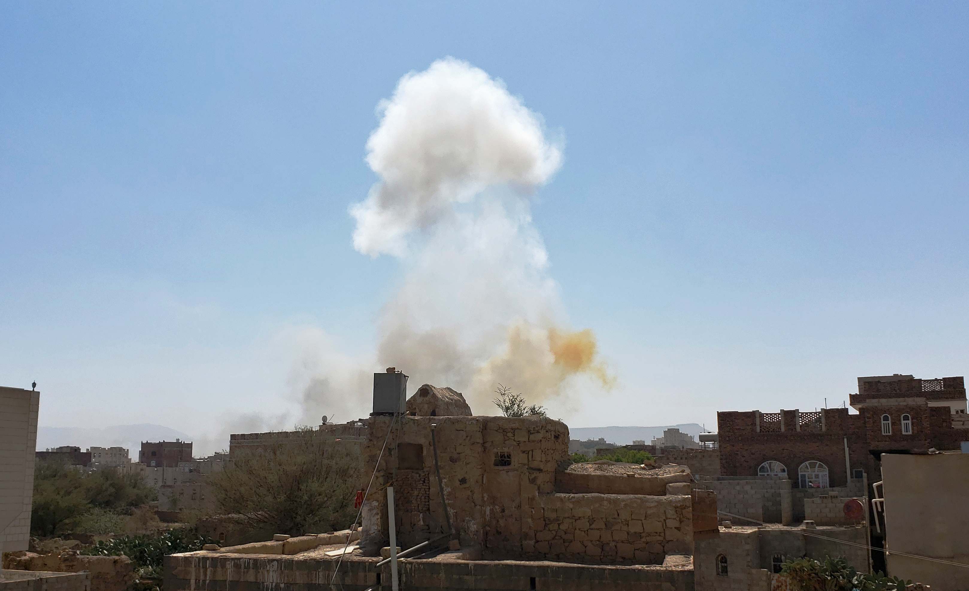 FILE - In this Mar. 7, 2021 file photo, smoke rises after Saudi-led airstrikes on an army base in Sanaa, Yemen. Saudi Arabia announced a plan Monday, March 22, 2021, to offer Yemen's Houthi rebels a cease-fire in the country's yearslong war and allow a major airport to reopen in its capital, the kingdom's latest attempt to halt fighting that has sparked the world's worst humanitarian crisis in the Arab world's poorest nation. (AP Photo/Hani Mohammed, File)